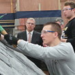 The Duke watches an Apprentice practising their Roofing skills