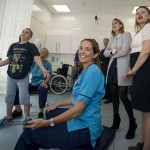 Princess Beatrice watches one of the children using the Secret Garden interactive device